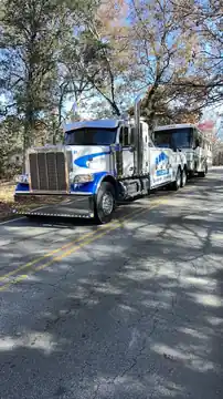 Randy's Towing wrecker on road